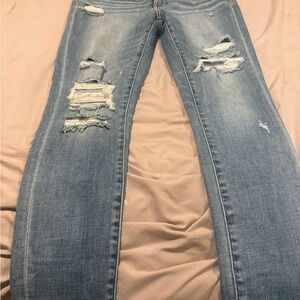 Buckle Light Blue Distressed Skinny Jeans